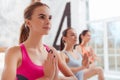 Three concentrated women having yoga classes