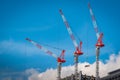 Three construction tower cranes operation at a construction site Royalty Free Stock Photo