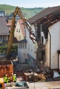 Stuttgart Wangen, Germany - April 27, 2020 - Construcrion workers watch demolition of old church Royalty Free Stock Photo