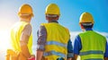 Three construction workers wearing yellow