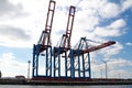 three container cranes in a container terminal in Hamburg, Germany Royalty Free Stock Photo