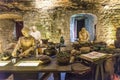 Three cooks prepare ingredients in the Great Kitchen for the next meal, Stirling Castle