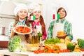 Three cooks with traditional Italian food products Royalty Free Stock Photo