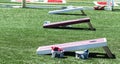 Three corn hole games set up on turf field Royalty Free Stock Photo