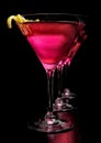 Three cosmopolitan drinks in line on black background Royalty Free Stock Photo