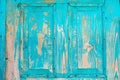 Texture of an old wooden turquoise door. the blue paint is peeling, cracked. vintage texture, background for your text Royalty Free Stock Photo