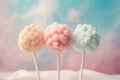 Three cotton candy cake pops on pastel pink and blue background. Generative AI Royalty Free Stock Photo