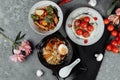 Three-course business lunch. cherry tomatoes with tofu mousse, thai rice with chicken and vegetables, asian noodle soup, ramen