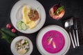 Three-course set on a table in a business lunch restaurant. Pink creme soup. Minced meat cutlets with mashed potatoes. Fresh Royalty Free Stock Photo