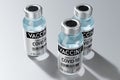 Three covid-19 / SARS-CoV-2 / coronavirus vaccine ampoules isolated on grey background