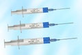 Three Covid-19 vaccination syringes