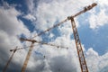 Three cranes in construction site