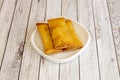three crispy Chinese spring rolls fried in olive oil