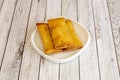 three crispy Chinese spring rolls fried in olive oil Royalty Free Stock Photo