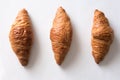 Three croissants on a white surface Royalty Free Stock Photo