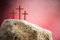 Three crosses against red sky on Calvary hill background. Crucifixion, resurrection of Jesus Christ. Christian Easter Royalty Free Stock Photo