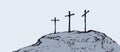 Three crosses stand on light sky backdrop