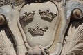 Three crowns carved in stone on royal palace in Stockholm in sweden on holiday.