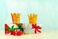 Three crowns of the three wise men with christmas gift boxes. Concept for Reyes Magos day. Three Wise Men Royalty Free Stock Photo