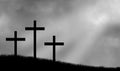 Three crucifix crosses on hill and ray of light Royalty Free Stock Photo