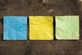 Three crumpled blank note papers in different colors Royalty Free Stock Photo