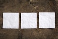 Three crumpled blank white note papers in a row