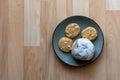 Three crunchy biscuits and bun on a plate