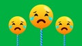 Three crying emoji expression isolated on green background with swinging motion