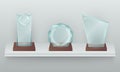 Three crystal awards on shelf realistic illustration