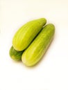 Three cucumbers stacked on isolated white background, fresh green raw cucumber Royalty Free Stock Photo