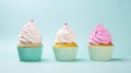 Three cupcakes with pink and white frosting on a blue background Generative AI