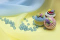 Three cupcakes and scattered beads