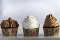 Three cupcakes on a white backdrop Royalty Free Stock Photo