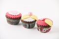 Three cupcakes on white background