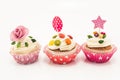 Three cupcakes on a white background