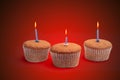 Three cupcakes on a wooden table Royalty Free Stock Photo