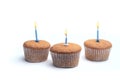 Three cupcakes on a wooden table Royalty Free Stock Photo