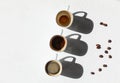 Three cups of coffee - full, half, and empty - coffee concept with copy space Royalty Free Stock Photo