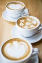 three cups of hot cappuccino coffees Royalty Free Stock Photo