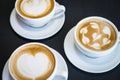 Three cups of hot cappuccino coffees Royalty Free Stock Photo