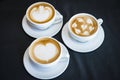 Three cups of hot cappucino coffees Royalty Free Stock Photo