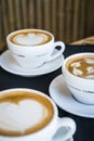Three cups of hot cappucino coffees Royalty Free Stock Photo
