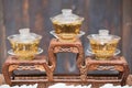 Three cups of tea on wooden decorative presentation