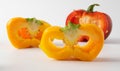 Three cut peppers. two yellow and one red. Royalty Free Stock Photo