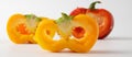 Three cut peppers. two yellow and one red. Royalty Free Stock Photo