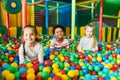 Three Cute Kids Playing in Ballpit Royalty Free Stock Photo