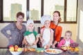 Three cute kids are preparing a fruit salad in kitchen Royalty Free Stock Photo