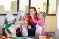 Three cute kids are preparing a fruit salad in kitchen Royalty Free Stock Photo