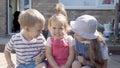 Three cute little Children enjoys delicious ice cream cone. Child eating watermelon popsicle. Kids Siblings snack sweets Royalty Free Stock Photo