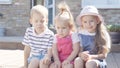 Three cute little Children enjoys delicious ice cream cone. Child eating watermelon popsicle. Kids Siblings snack sweets Royalty Free Stock Photo